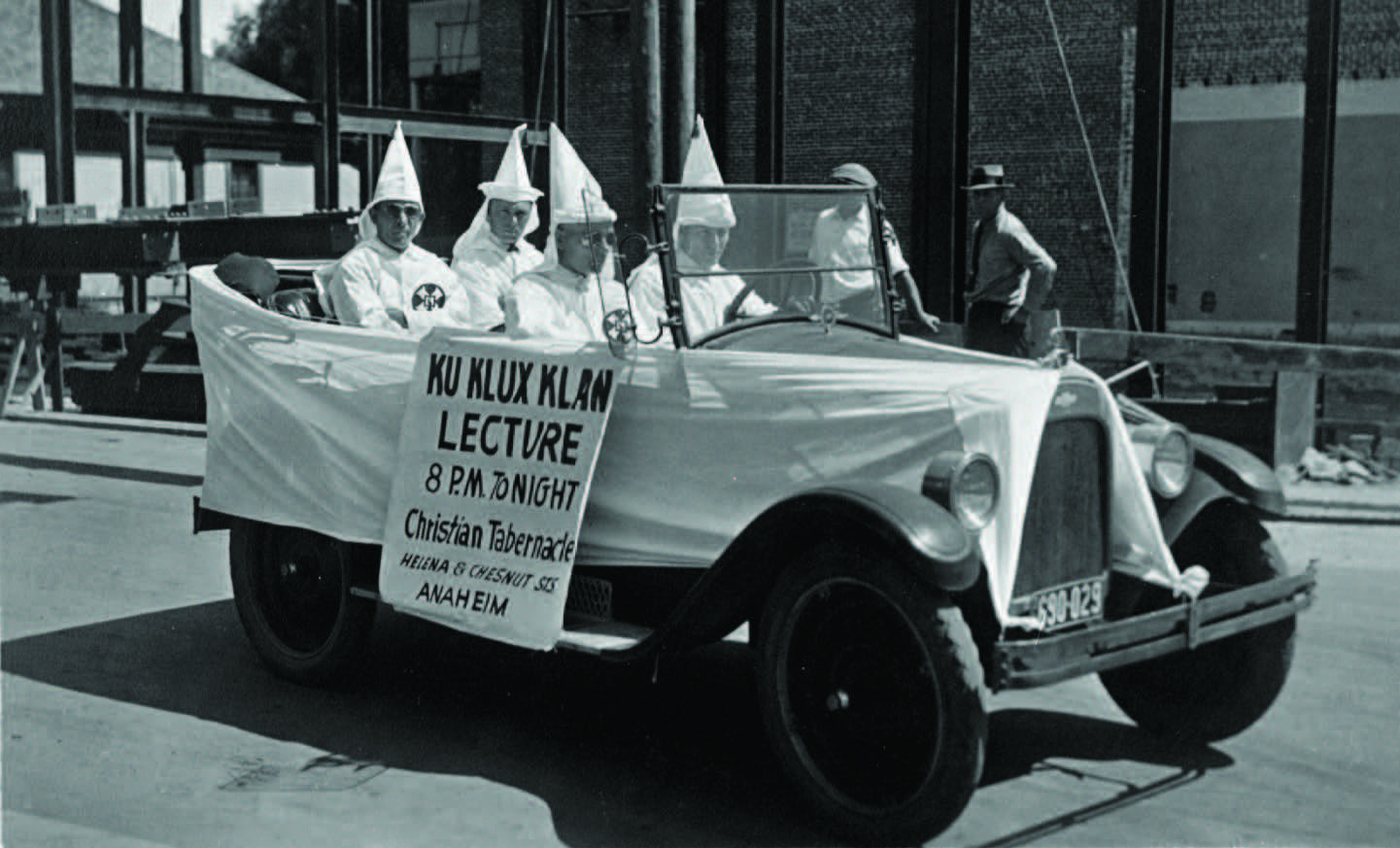 Four Klansmen in a car